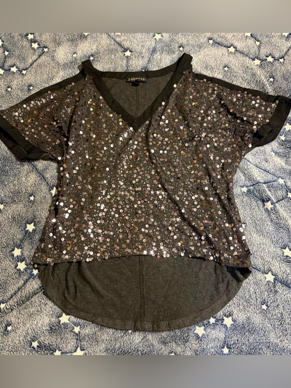 Black & silver sequin blouse with a V-neck and shoulder cut in sleeves